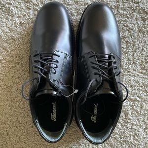 Thorogood, black dress shoes that have never been worn.